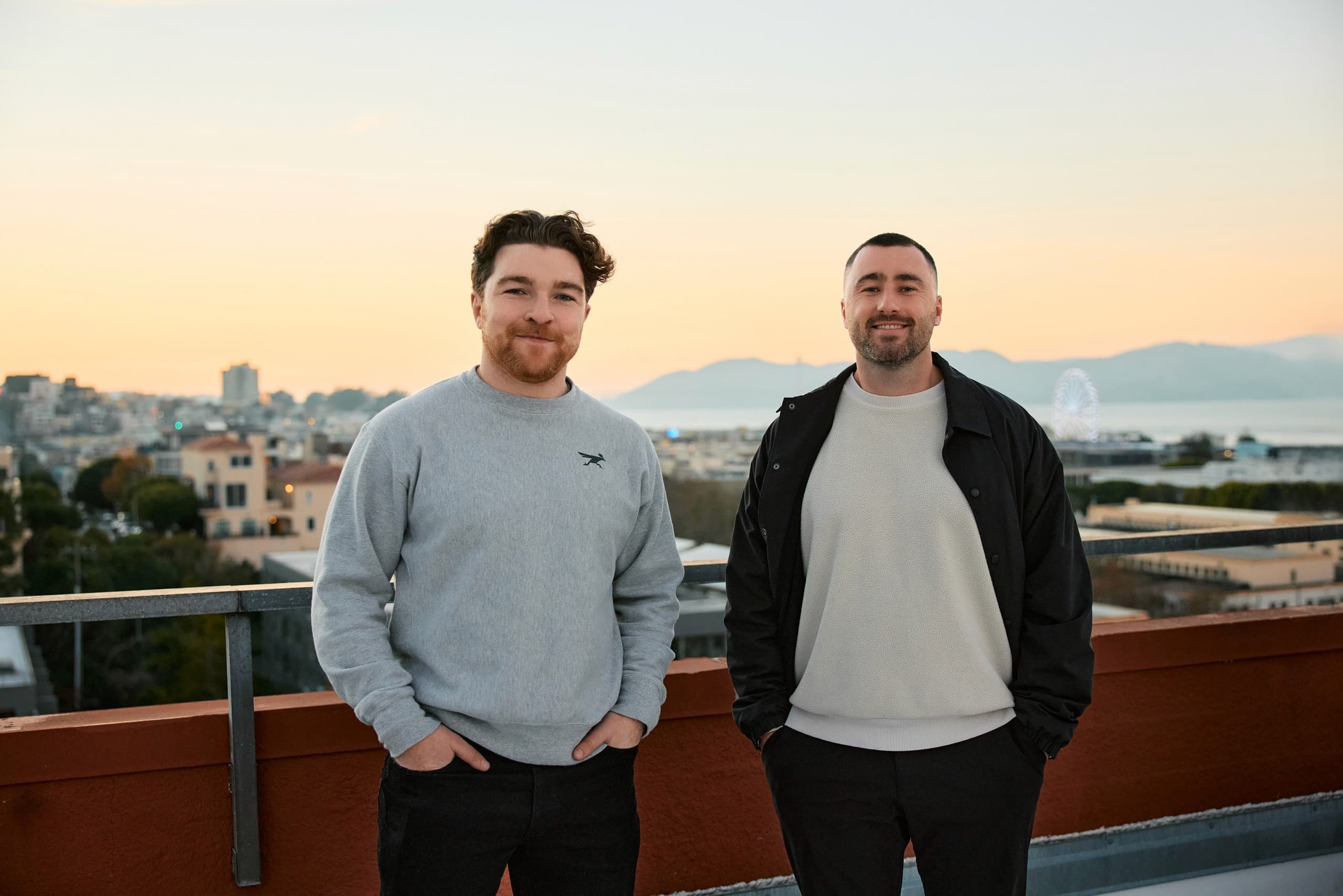 Solidroad's two founders on a San Francisco rooftop at sunset